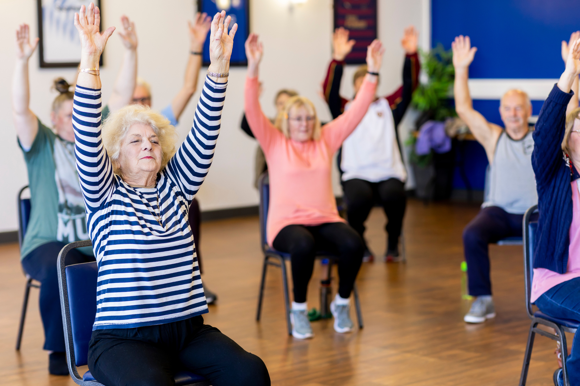 Seniors participating in a group exercise class, staying active and feeling younger every day in Waterford, WI.