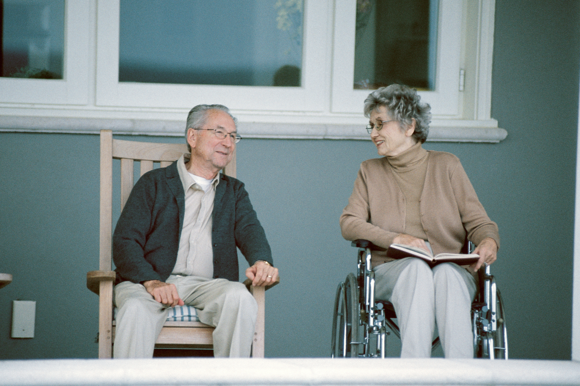 Elderly couple enjoying outdoor seating - Assisted Living Info Waterford WI